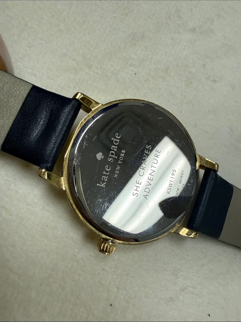 kate spade Gold-Tone Sagittarius Watch with Black Strap and Mother-of-Pearl Dial